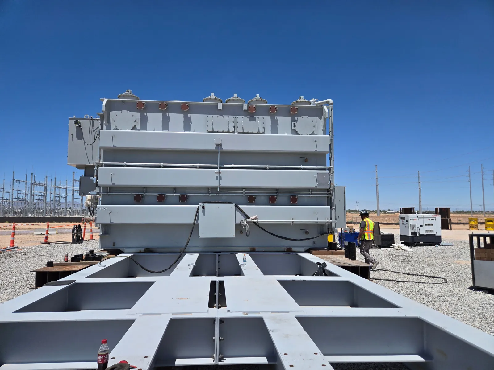 Steel slide beams laid out from the trailer to the set position